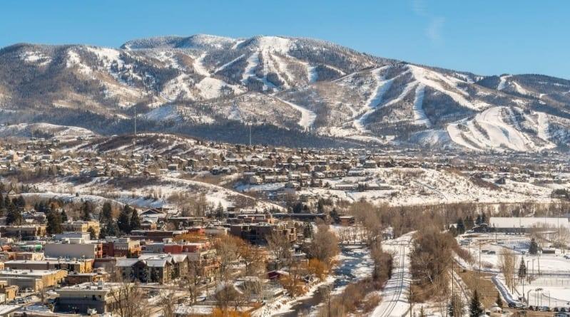 Aerial view of downtown with mountains in the background